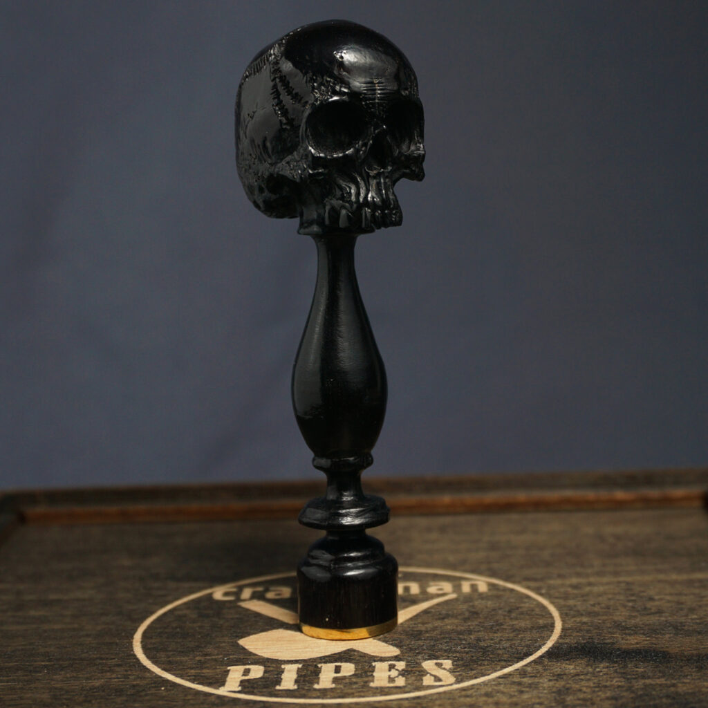 Skull pipe tamper
