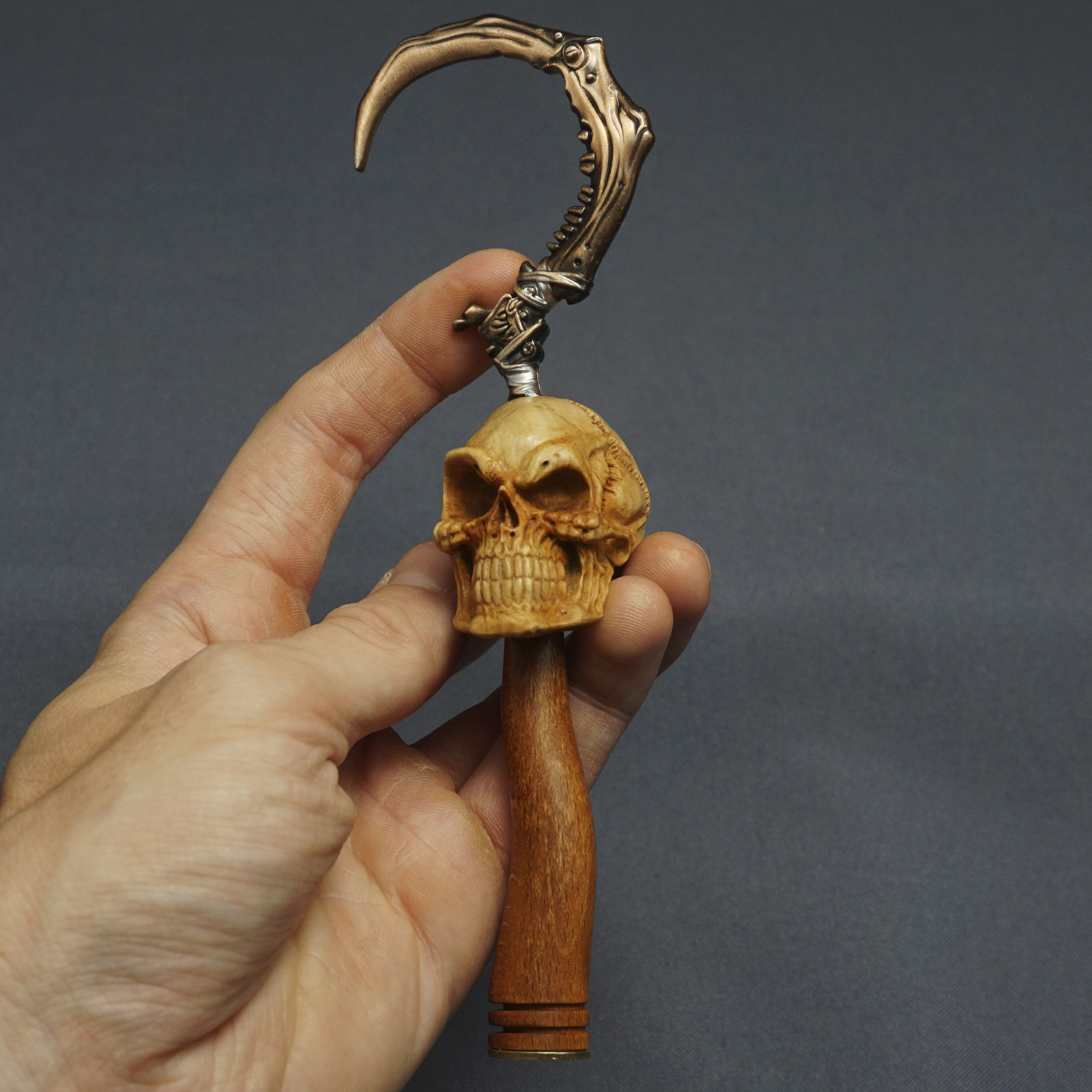 Smiling skull. Wood carving pipe tamper