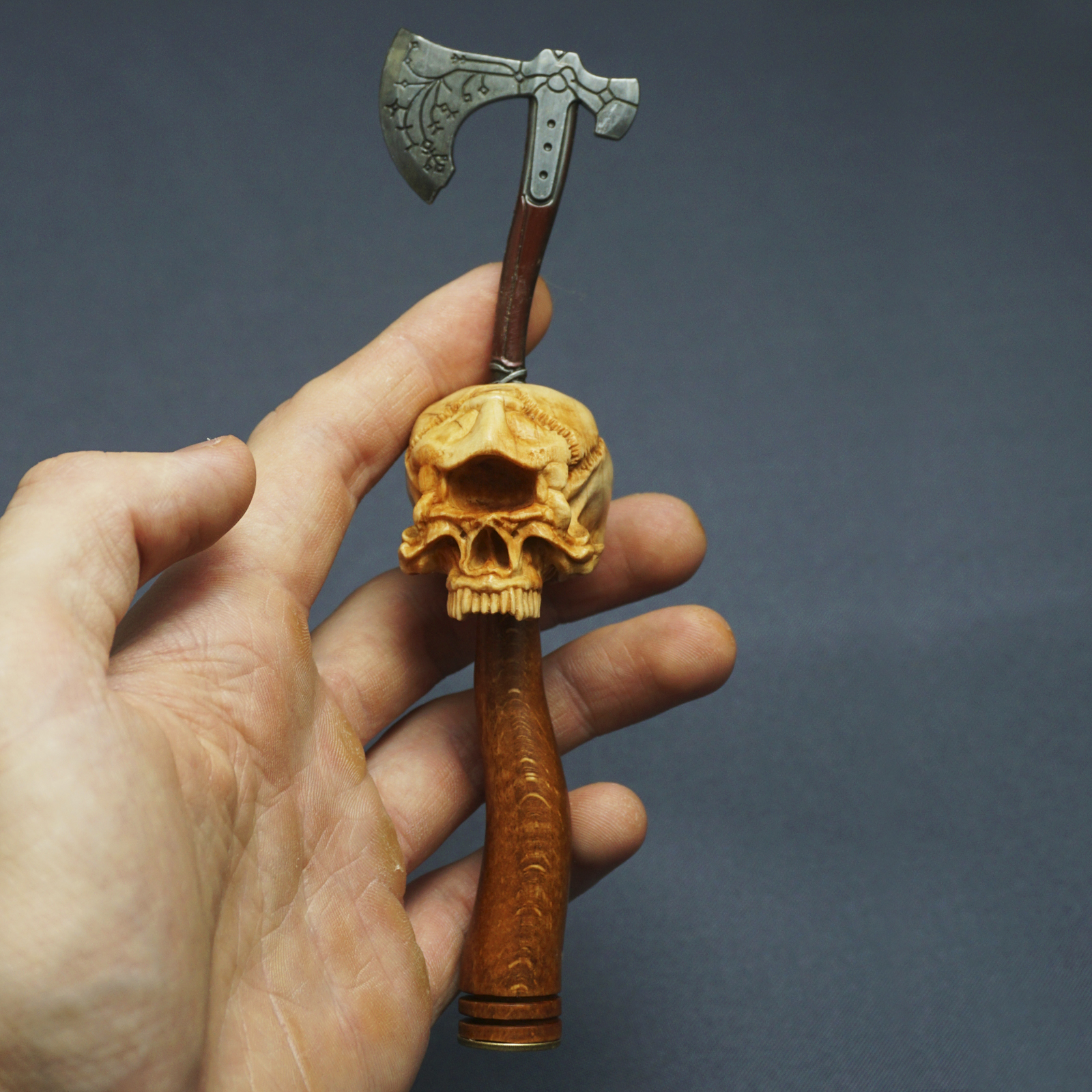 Cyclops skull. Wooden pipe tamper